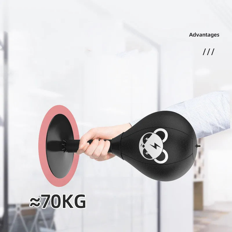 Tabletop boxing speed ball with suction cup base, inflatable PU leather ball, pump, and optional gloves on a desk.