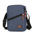 Solid colour Oxford cloth crossbody commuter bag with contrast details in silver grey.