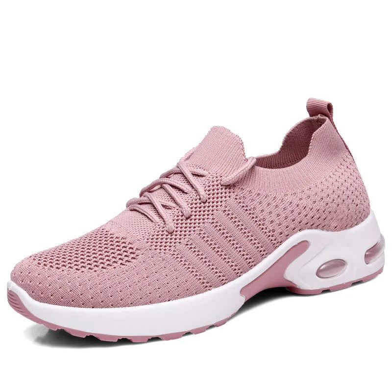 Women's black mesh sneakers with a round toe, front lace-up, and soft PVC sole.