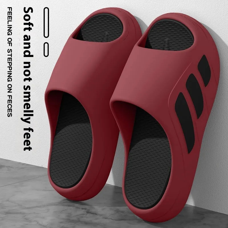 Pair of EVA platform slippers in a two-tone colour scheme, showing flip-flop style with letter detailing.