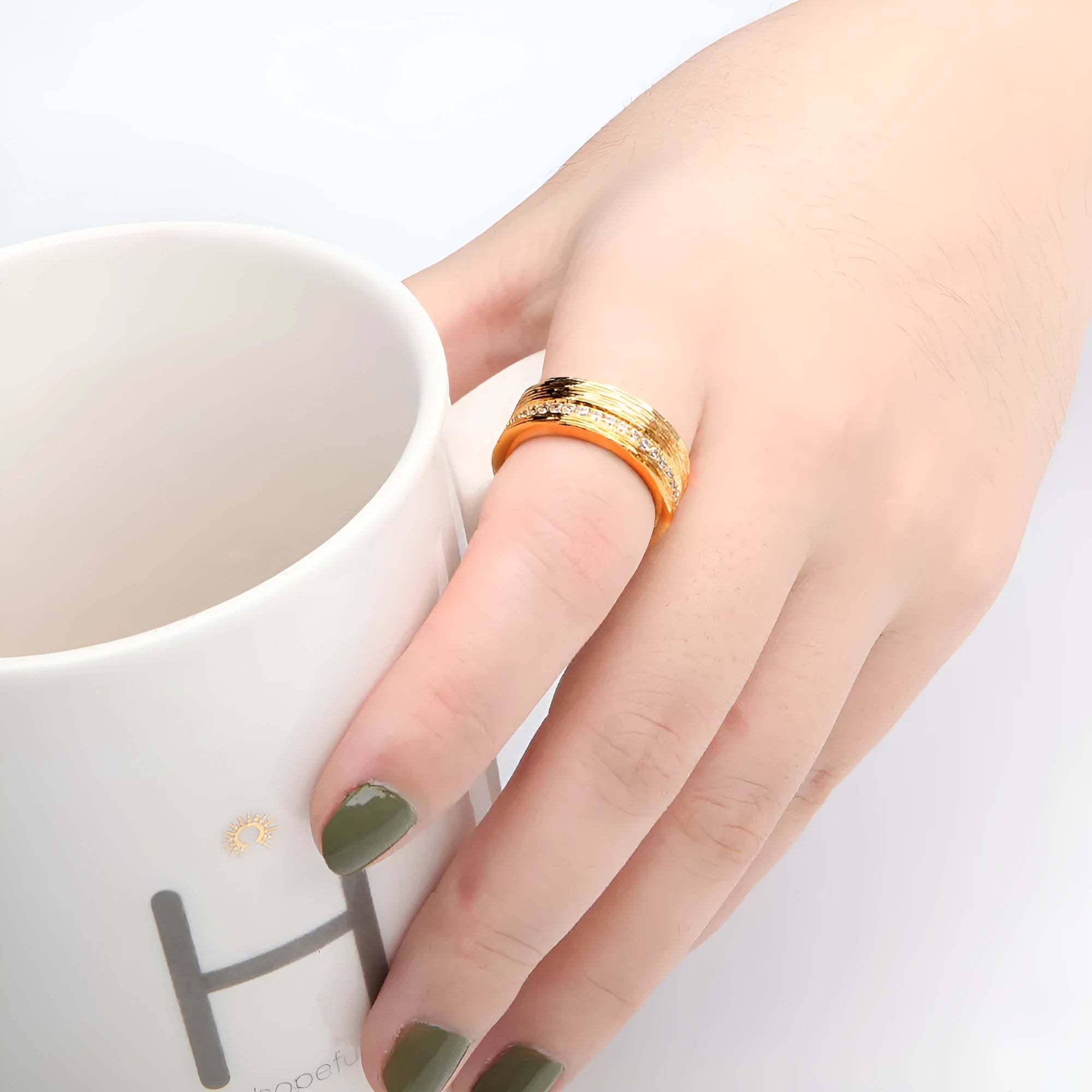 Gold-coloured geometric women's ring with zircon stone, shown from multiple angles
