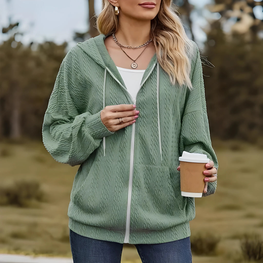 Green women's hooded sweater coat with zip front, loose fit, and long sleeves.