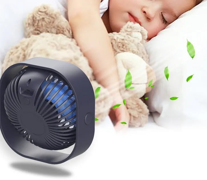 USB desk fan with alarm clock display in blue, showing 360-degree rotation capability.