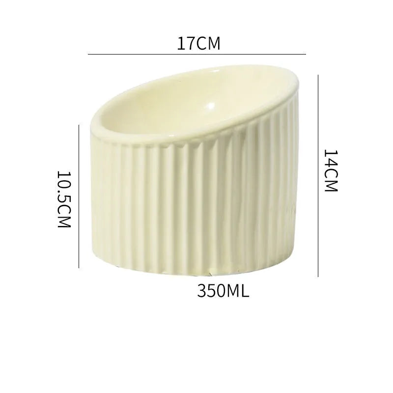 Elevated ceramic cat bowl in green colour showing raised, tilted design for food or water.