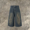 Men's black cropped denim shorts with flame embroidery patch and straight-leg cut