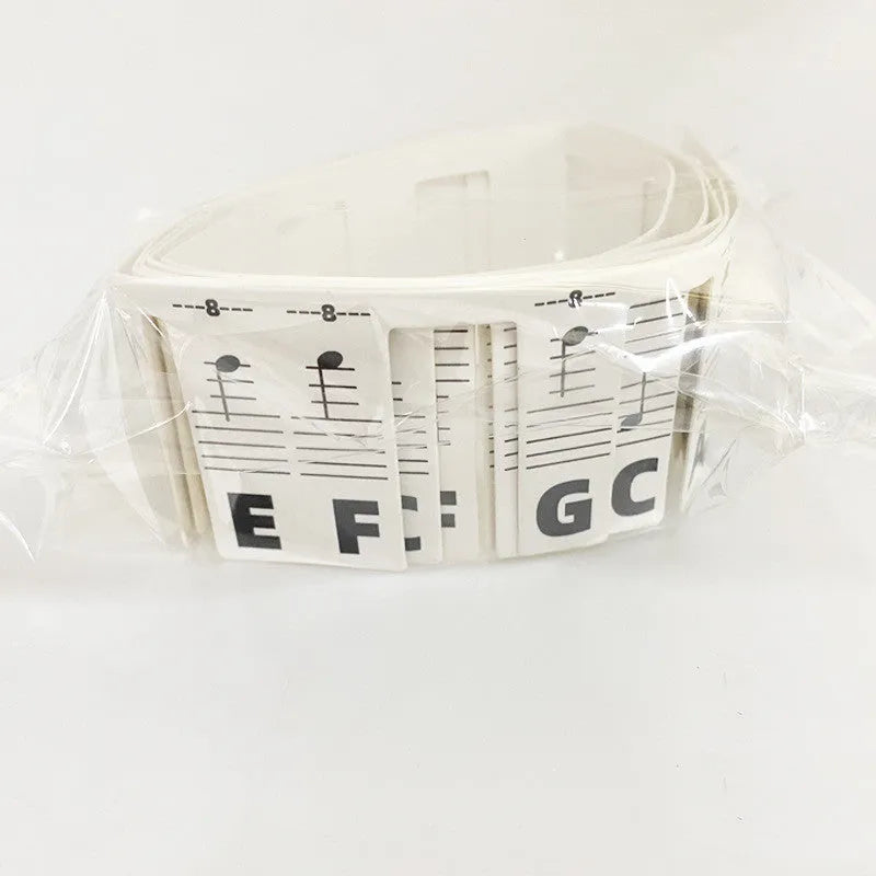 Piano keyboard stickers with colour note bars and black notes for 88-key learning on white card