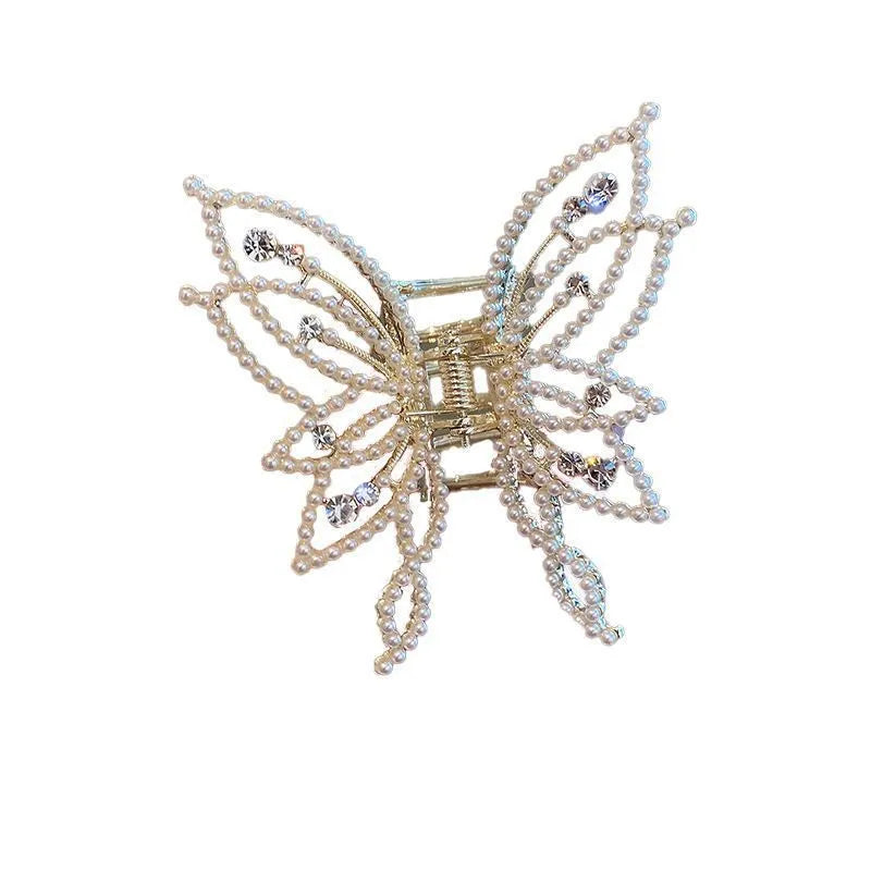 Butterfly-shaped alloy hair clip for women with electroplated finish, shown in rhinestone and pearl styles.