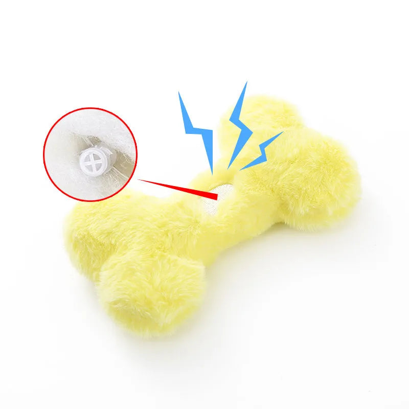 Blue plush bone-shaped dog toy with a squeaker, labelled Grinding Teeth, on a plain background