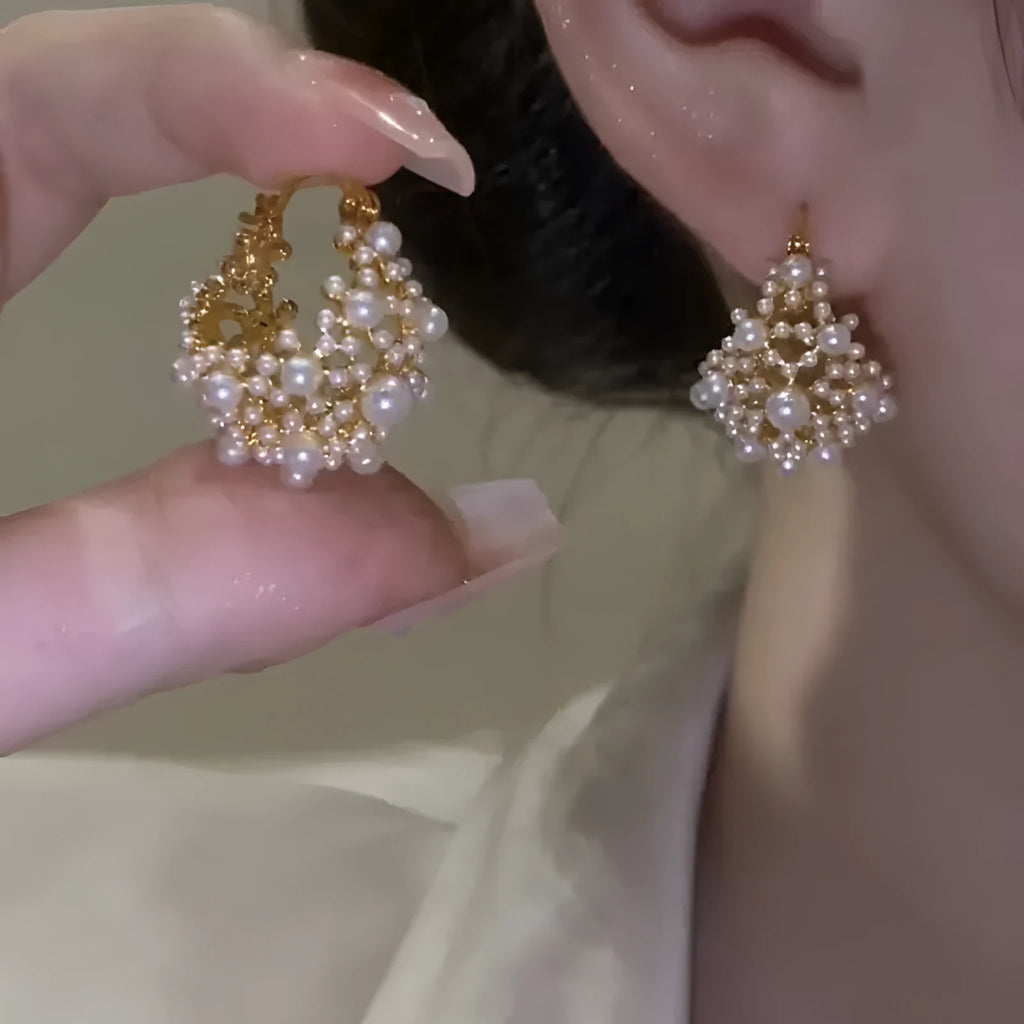 Gold-coloured copper flower basket earrings with pearl inlay and small rice-shaped bead detailing