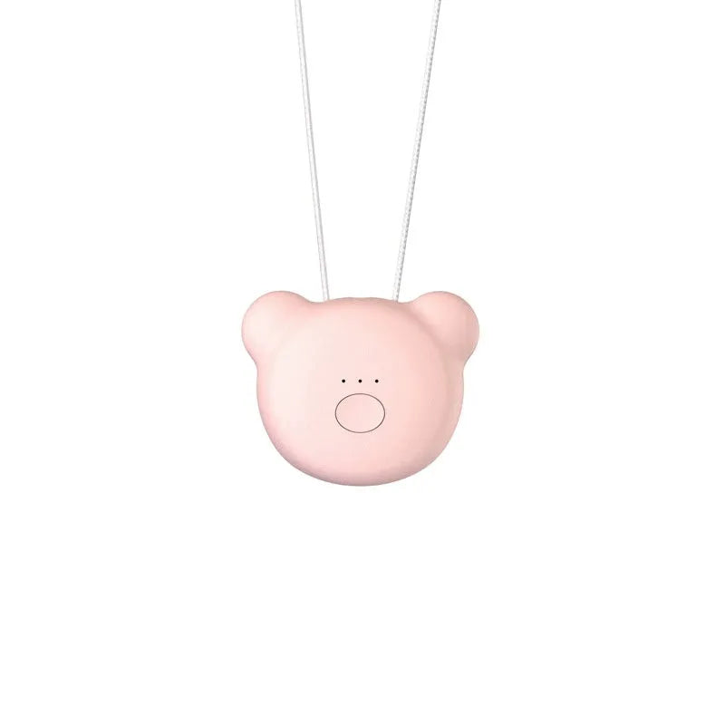Pink and blue wearable USB air purifier necklace shown on a person, with dimensions 1.5 by 5.7 by 4.5 cm.