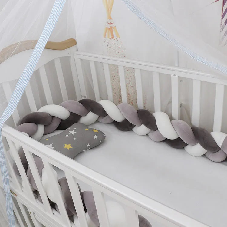 Braided knot cot bumper cushion in spandex velvet for crib safety protection.