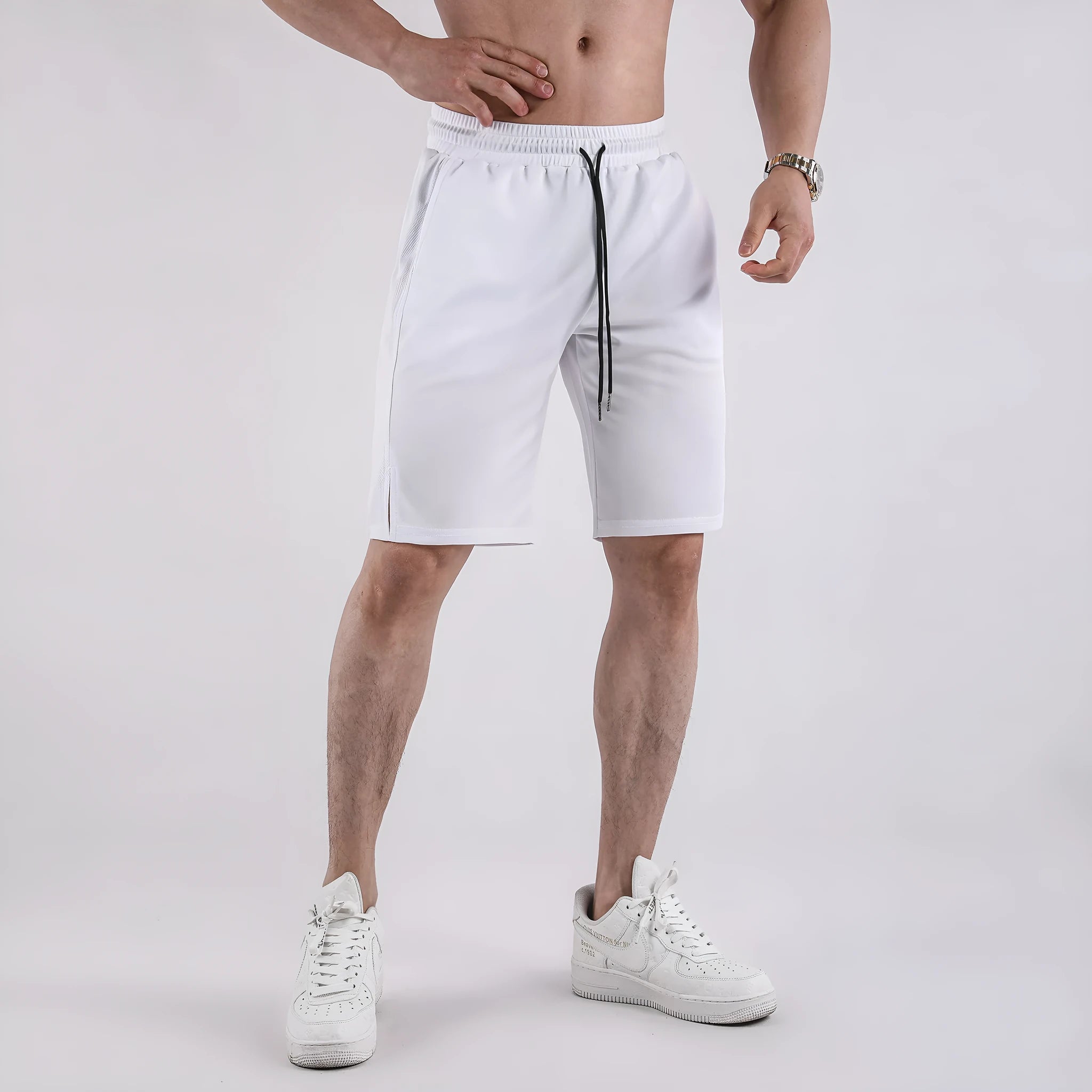 Men's black quick-dry mesh shorts with elastic waist, shown in a loose, casual fit.