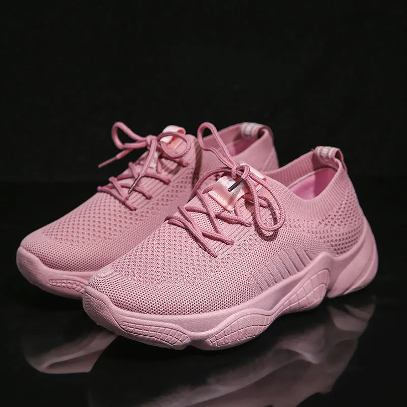 Women's white sport shoes with thick rubber soles and woven upper fabric with front strap closure