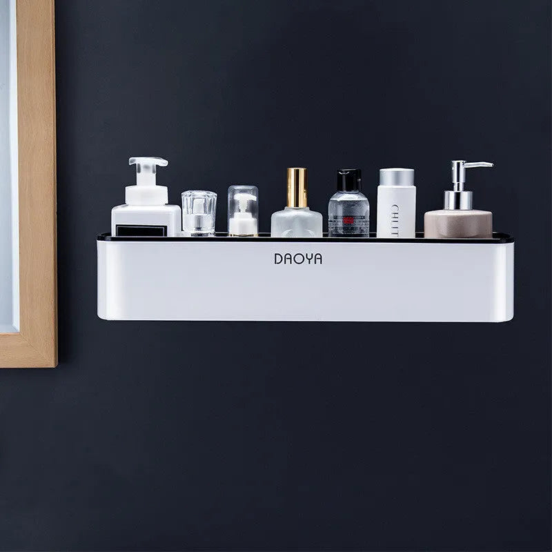 Black wall-mounted bathroom shelf with hole-free installation holding shampoo and shower gel bottles