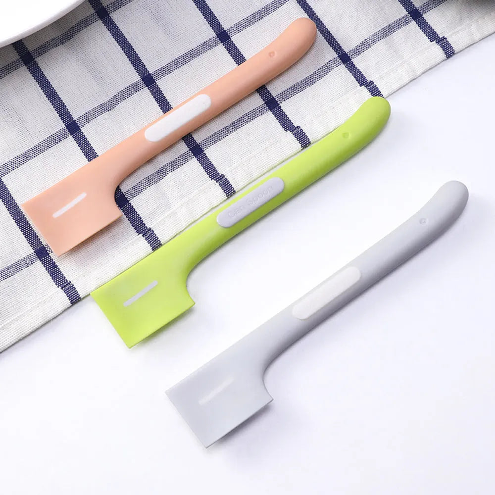 Long-handled TPR pet food spoon in green colour with right-angle scraper design for canned food