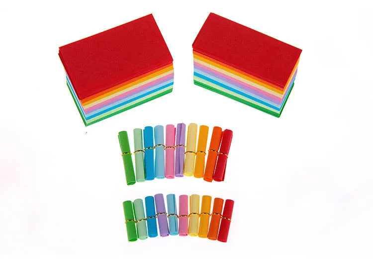 Assorted colourful mini paper scrolls with central metal eyelets for drift bottle messages.