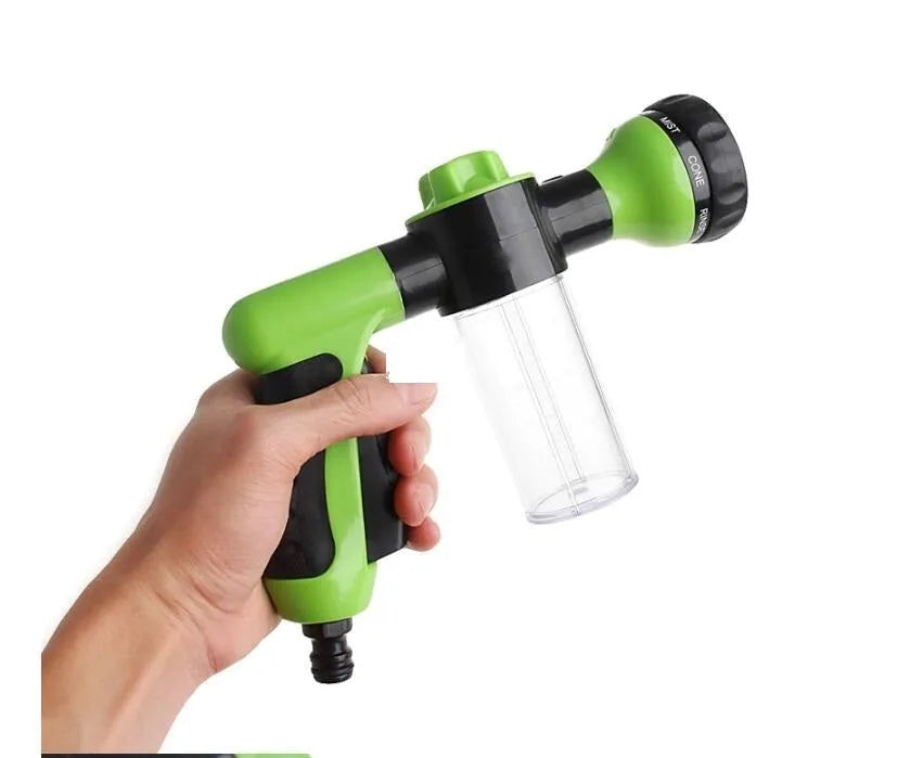 Green high pressure foam spray gun with multiple spray pattern settings and hose connection