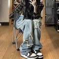 Blue high-waist straight-leg women's denim trousers on a hanger.