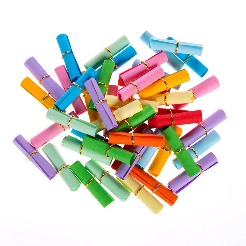 Assorted colourful mini paper scrolls with central metal eyelets for drift bottle messages.