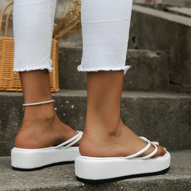 Women's thick sole flip-flops in various colours with herringbone pattern PU upper and rubber sole.