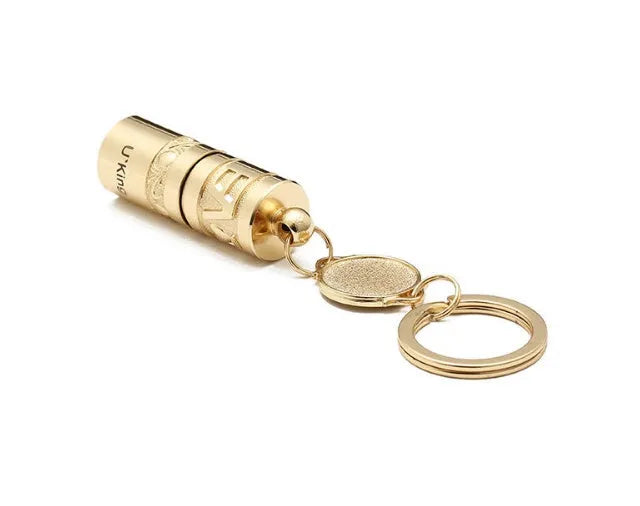 Gold-coloured zinc alloy keychain torch with LED light on a keyring.