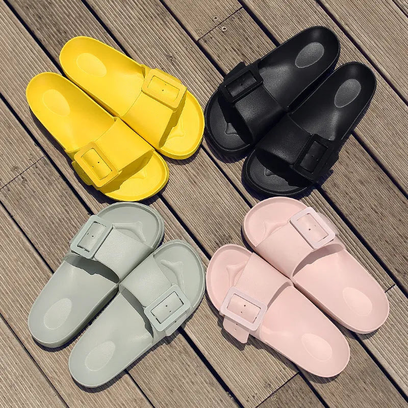 Women's grey blue buckle flip flop sandals with EVA sole on neutral background