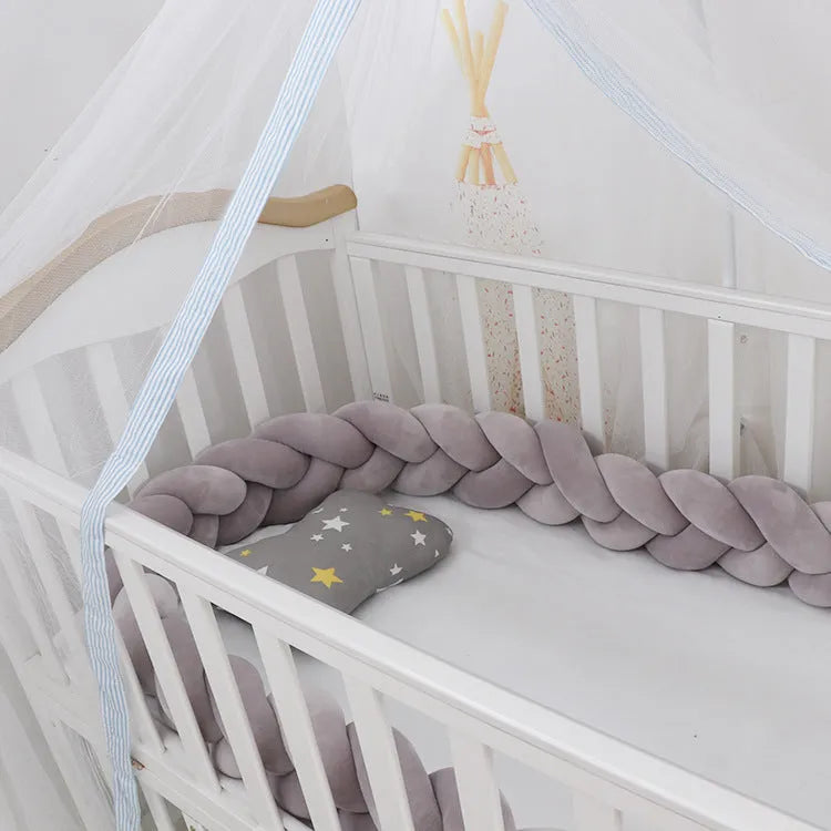 Braided knot cot bumper cushion in spandex velvet for crib safety protection.