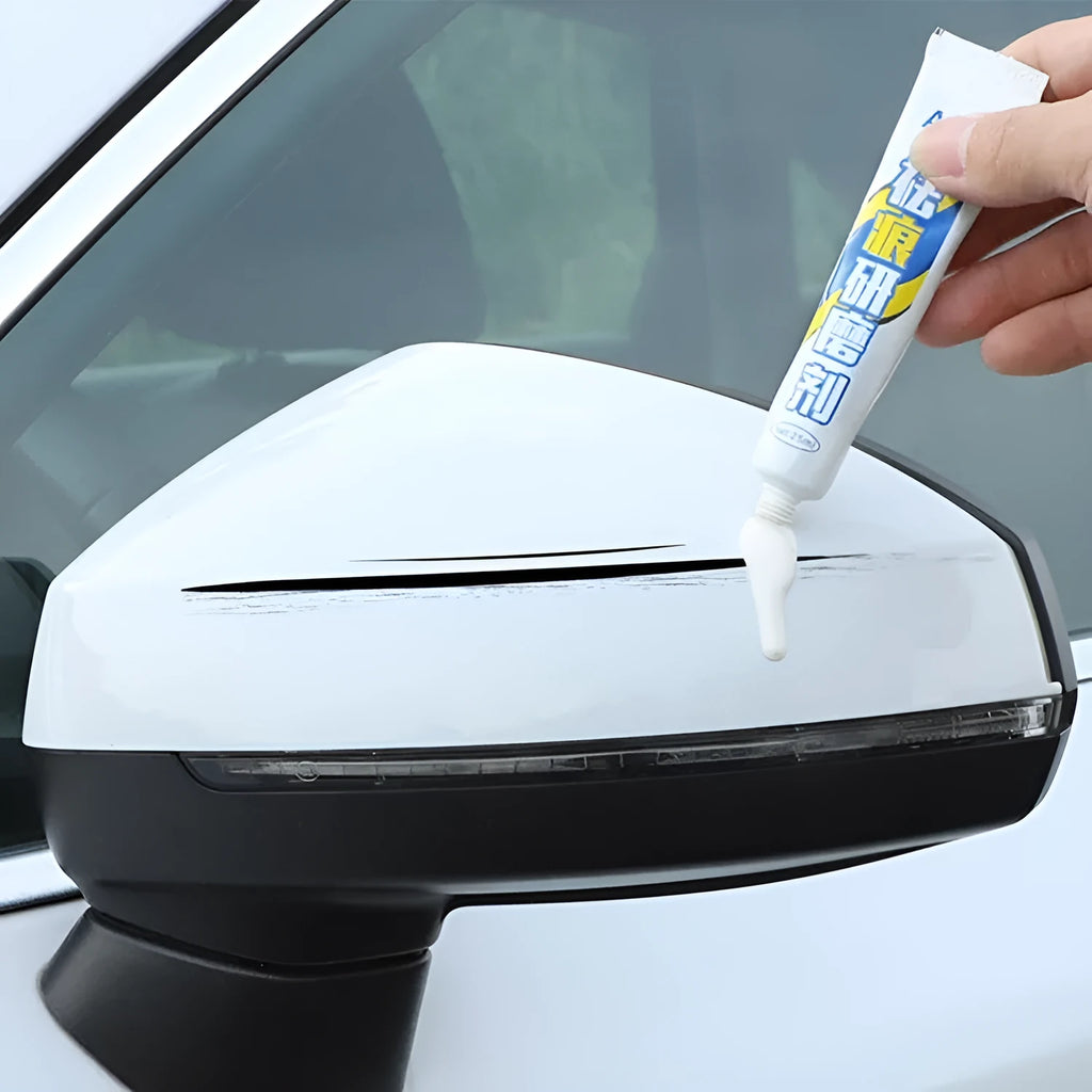 Automotive paint repair pen and scratch removal fluid 4-piece set for car touch-ups.