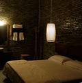 Natural bamboo plait wall lamp with woven design and E27 bulb holder