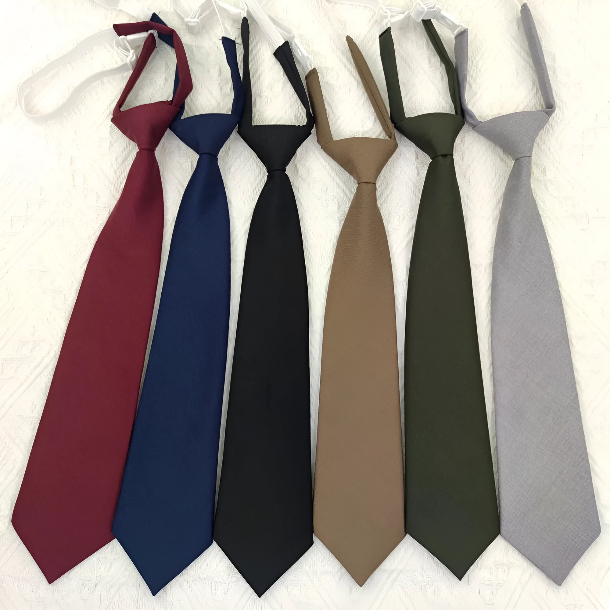 Men's navy blue cotton bow tie with arrow style design and solid colour