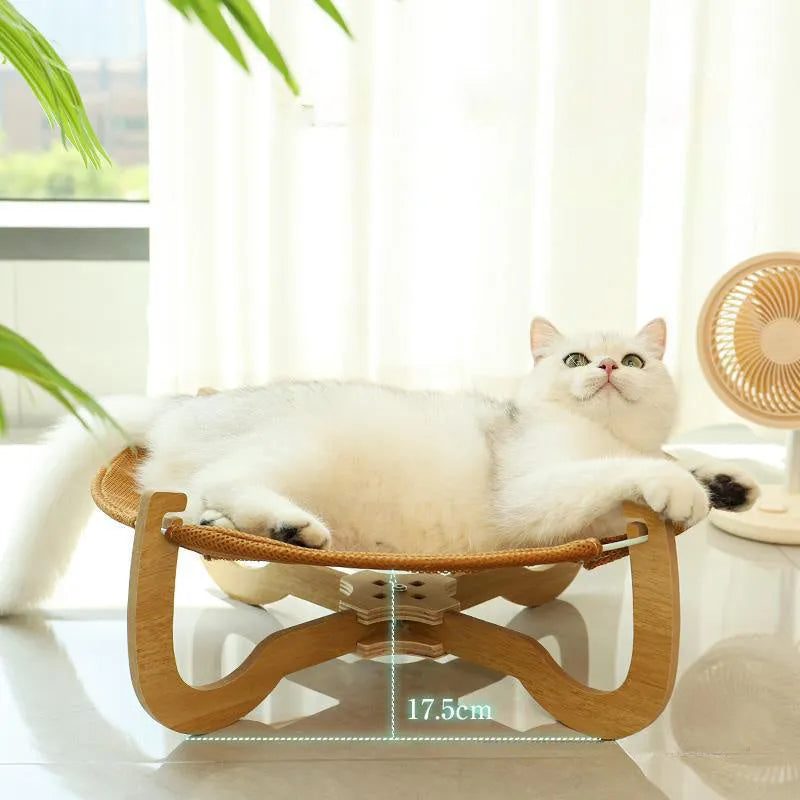 Brown woven rattan square pet hammock bed for cats and dogs, elevated off the ground.