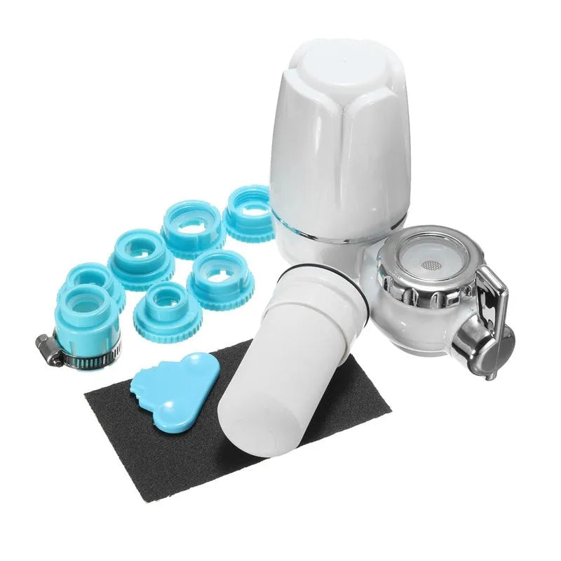 White plastic faucet water filter with adapter kit and ceramic cartridge for kitchen tap installation.