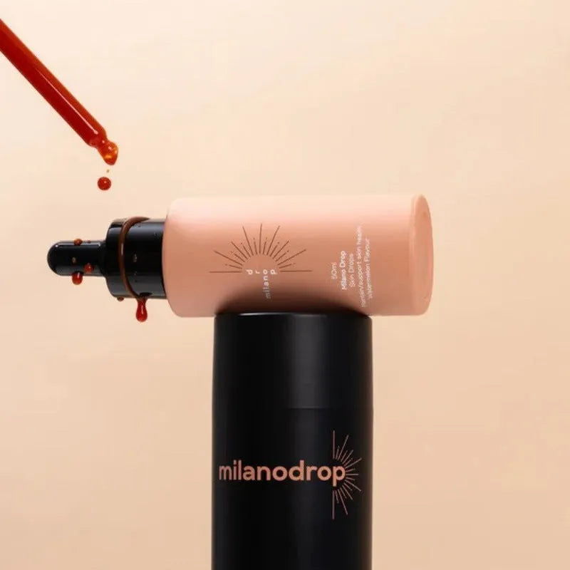 Matte black self-tanning liquid set showing 50ml tanning drops and 75ml flash cream bottles