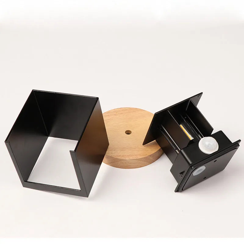Compact cubic corridor wall lamp in black finish with adjustable colour temperature settings