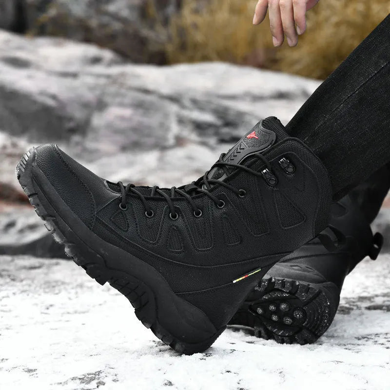 Men's beige cowhide leather hi-top hiking shoes with a platform sole on a rocky outdoor trail.