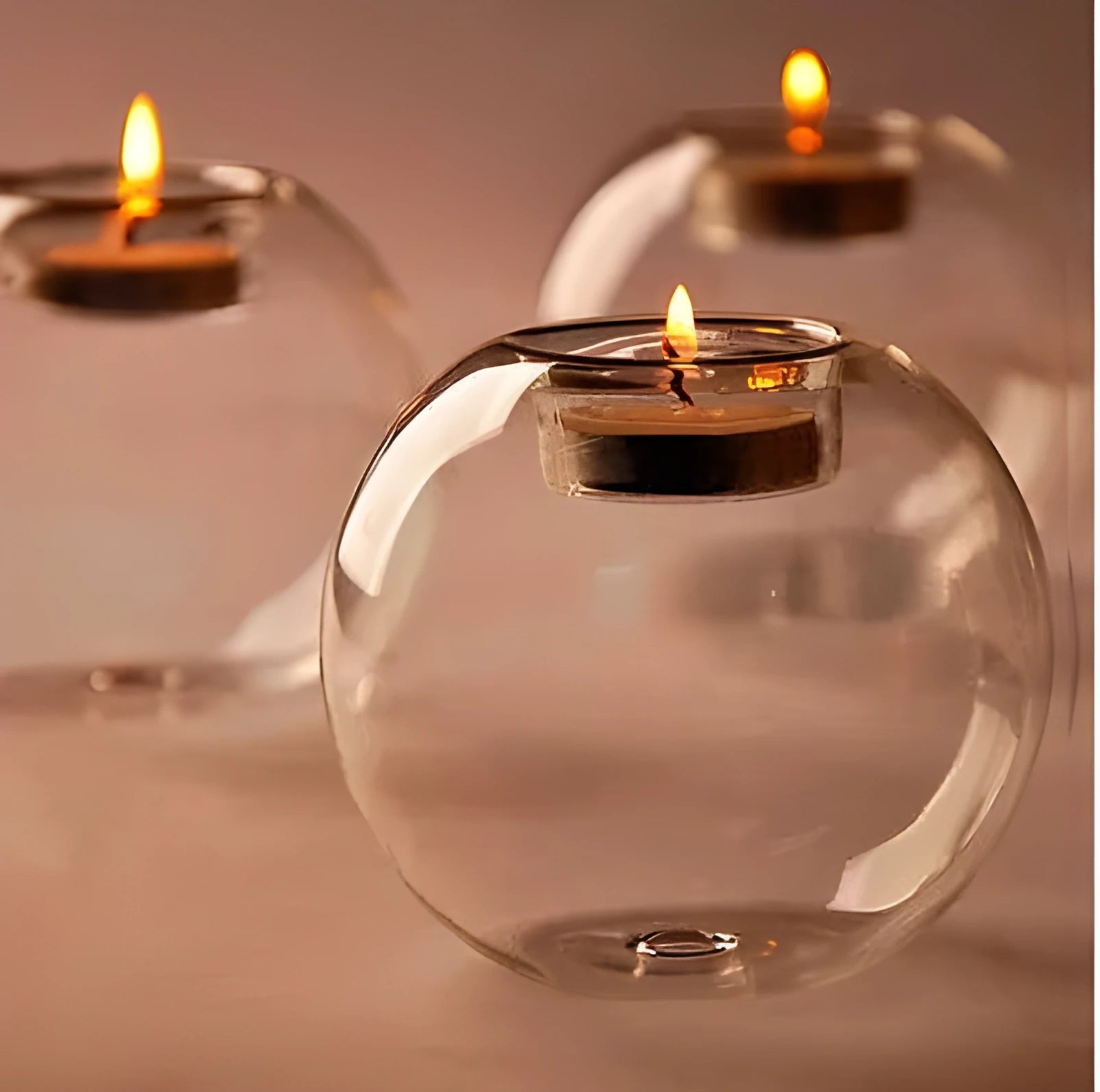 Round hollow glass candle holder showing handcrafted European-style spherical design