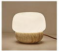 Cream coloured retro style bedside lamp with a button switch, measuring 18cm by 17cm.