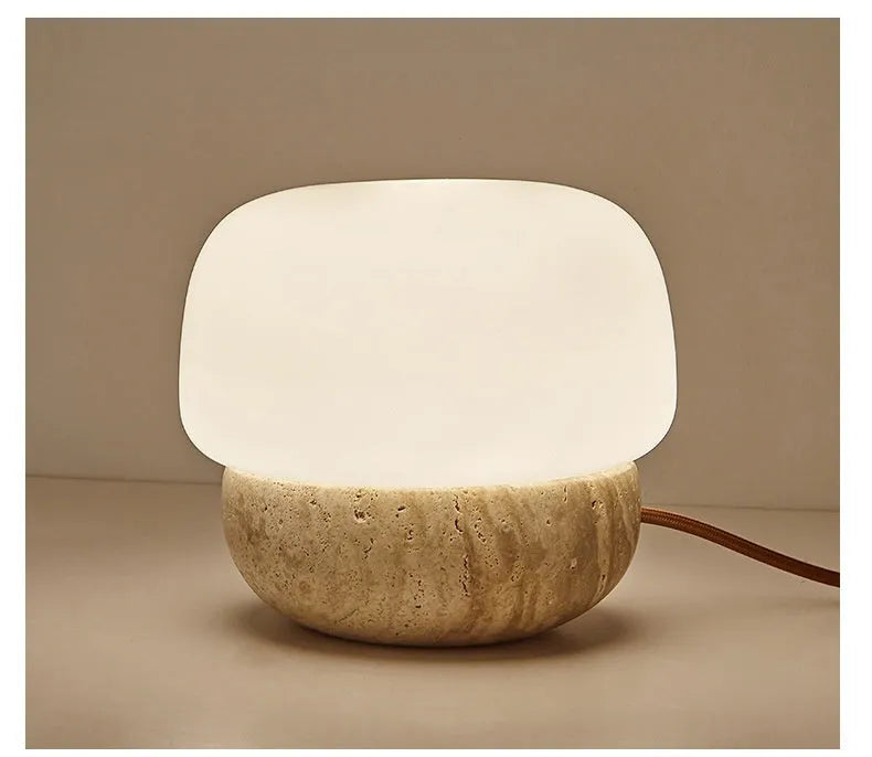 Cream coloured retro style bedside lamp with a button switch, measuring 18cm by 17cm.