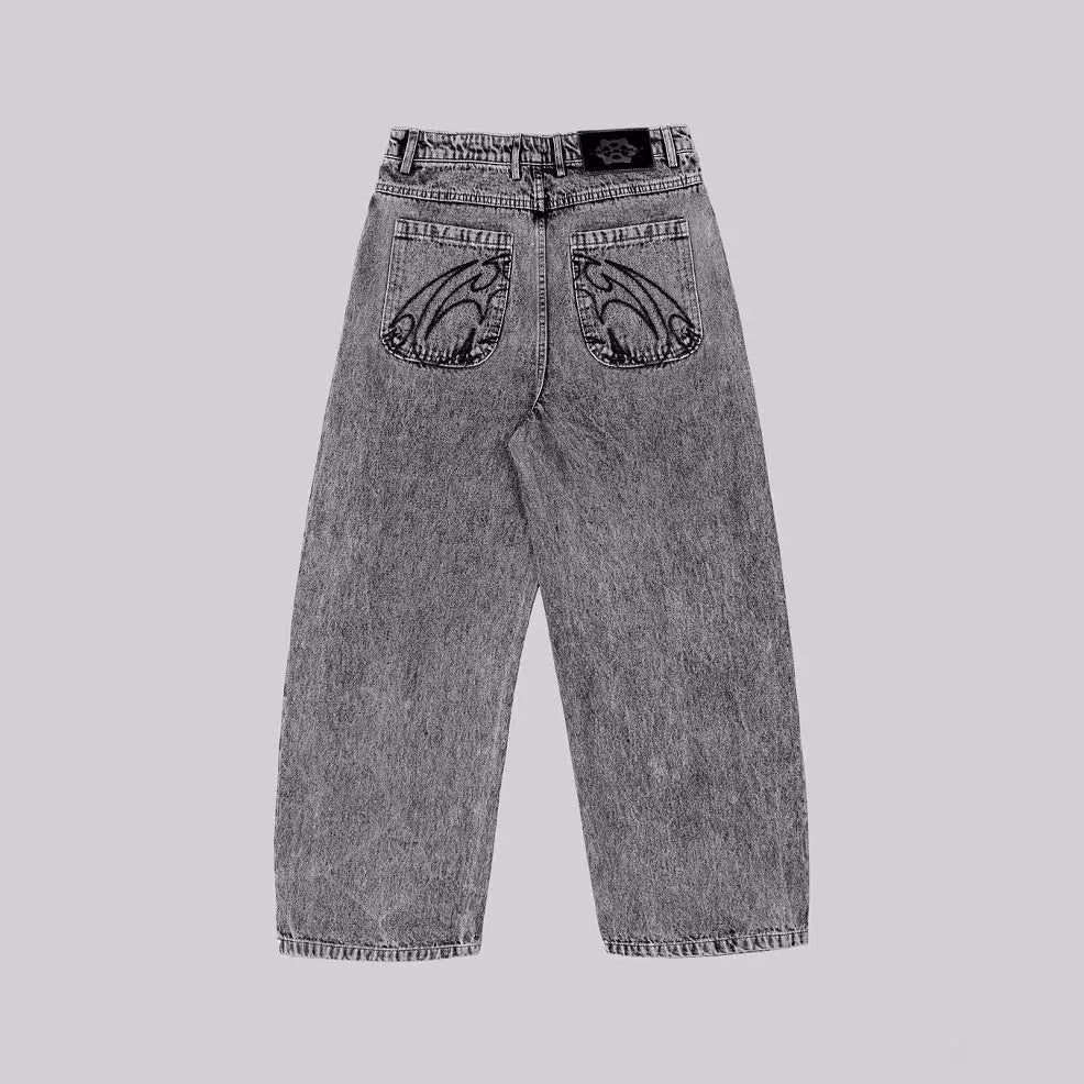 Grey loose straight-leg denim trousers for men and women on a neutral background