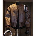 Men's black extended length PU leather jacket with litchi grain texture, shown in a tight business fit.