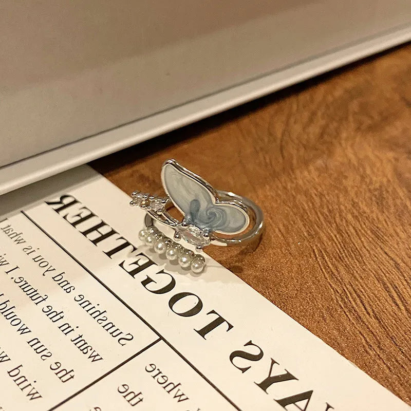 Butterfly women's copper ring with adjustable split ring design showing oil-drip colour treatment