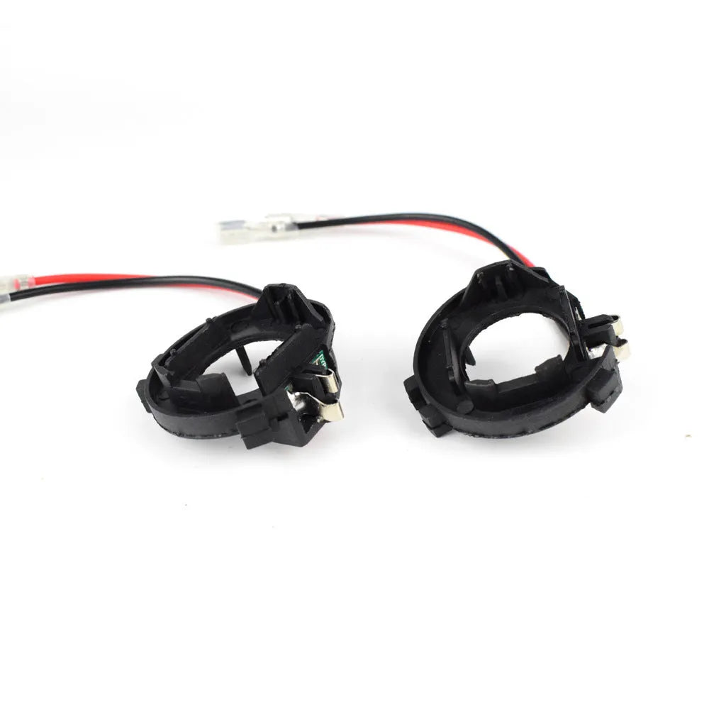 Black plastic H7 LED headlight adapter bracket with copper wiring for Volkswagen cars.