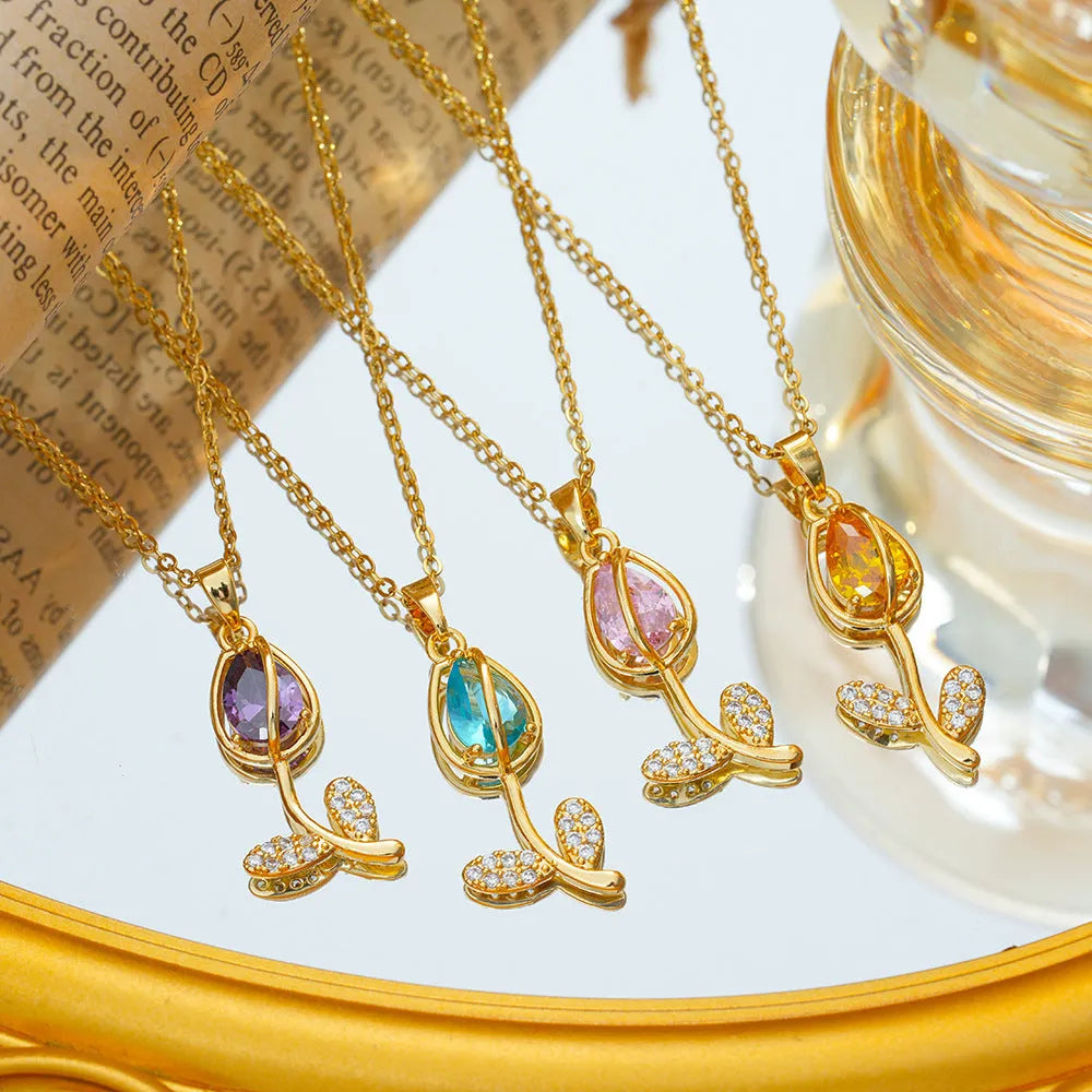 Zircon tulip necklace for women in gold colour on adjustable O-ring chain, showing floral pendant shape.