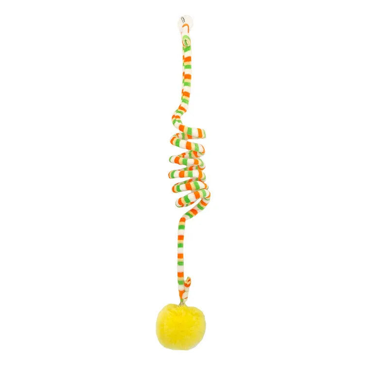 Colourful suction cup cat toy with spring wand and inflatable ball, hanging on a glass door