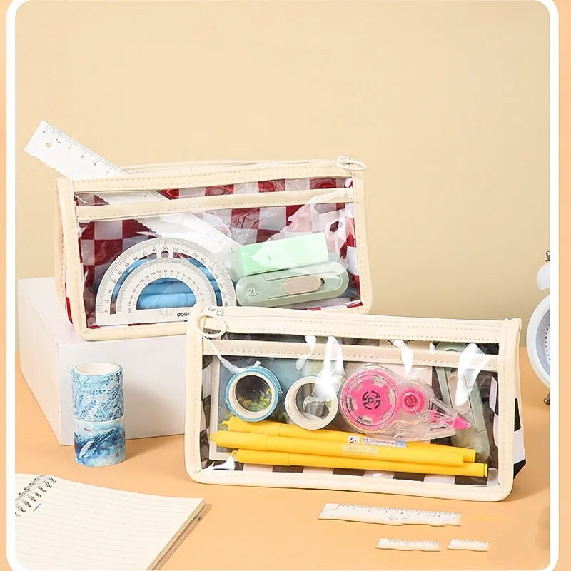 Transparent PVC pencil case with chessboard pattern showing pens inside
