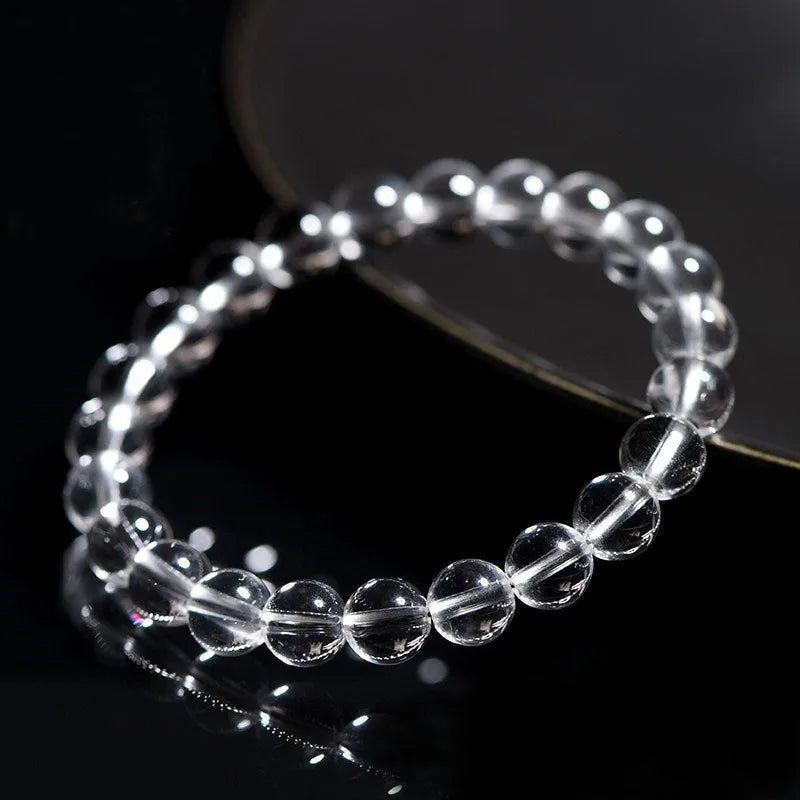 Natural Donghai white crystal bracelet with round water beads on a wrist, showing geometrical unisex design.
