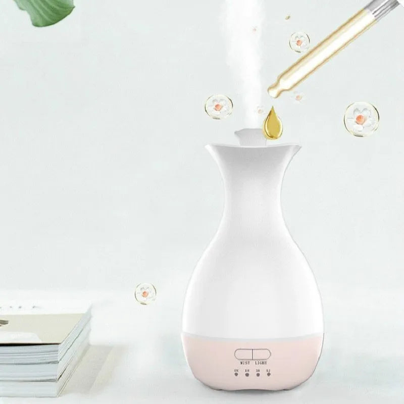 White ultrasonic aromatherapy vase humidifier with colourful LED night light and 200ml water tank.