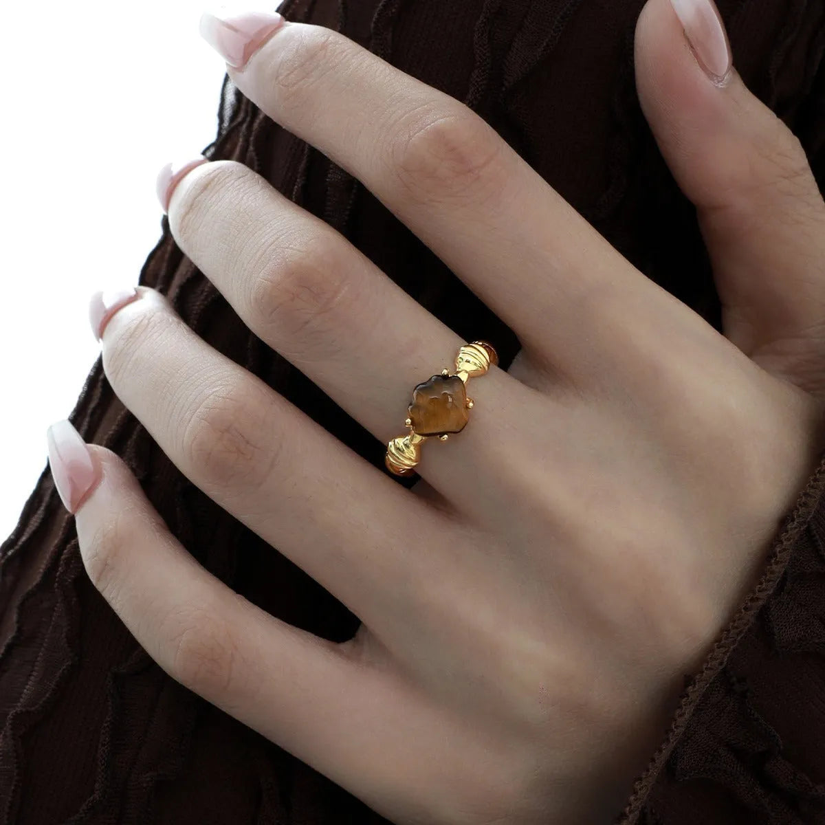 Adjustable silver ring with shell and tiger eye decoration in white gold or 18K gold electroplated finish.