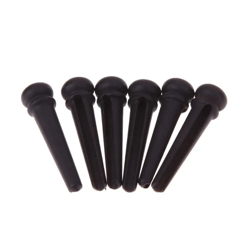 Set of six matt black ebony guitar string nails for folk acoustic instruments
