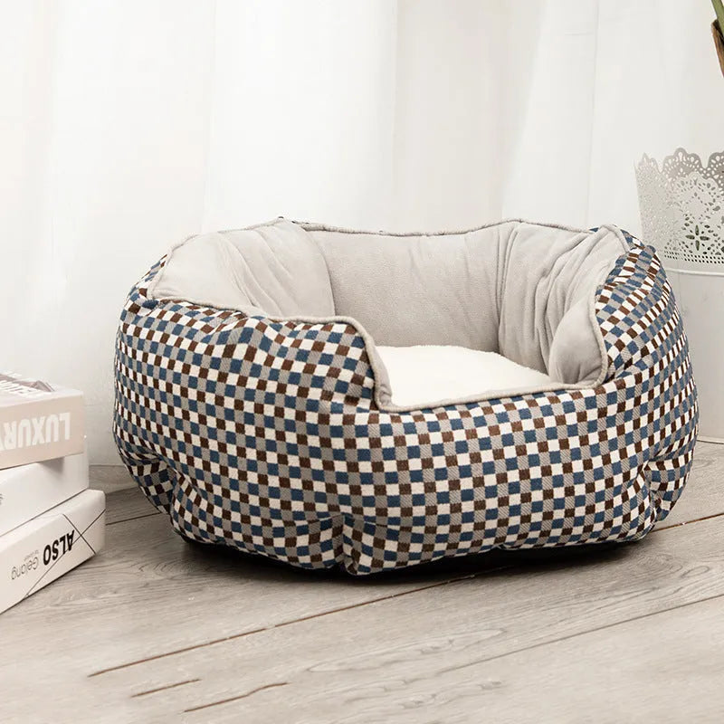 Blue octagonal pet bed for small dog with high sides and removable interior mat.